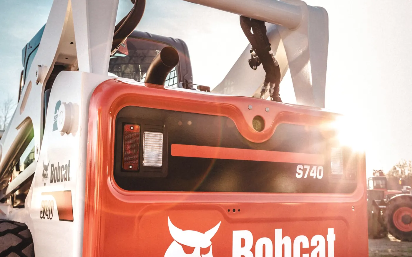 Skid steer loader working a dirt site